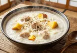 シュクメルリ風粥(鶏・さつまいも・にんにく・生クリーム・レモン汁・乗せチーズなど)（風邪・胃腸炎の回復に お粥小屋 健康お粥専門店）