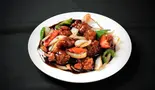 鶏肉の黒酢炒め 黑醋鸡块（本格四川料理 聚友楼）