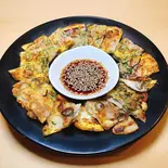 豚肉と玉子のネギチヂミ（たべ呑み屋 じゅじゅ）