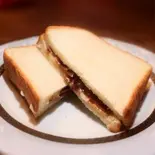 トリュフバターと生ハムチーズのビキニ（スペインバル ラ・ピカーダ・デ・トレス Spain Bar La Picada de tres）