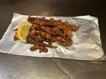 【当店人気No.3】秘伝のタレに漬けたゲソの竜田焼き(鉄板広島焼き 鉄心)