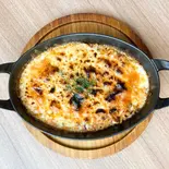 自家製ミートソースたっぷりの焼きチーズリゾット（Risotteria. GAKU hiragishi）