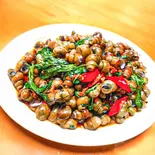 炒田螺 (タニシ炒め)（中国料理 壺家大排档）