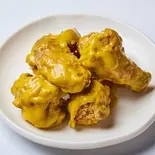 ハニーマスタードチキン(骨付き半羽) + チキンム(大根ピクルス)付き（韓国家庭料理ジャンモ 聖蹟桜ヶ丘店）
